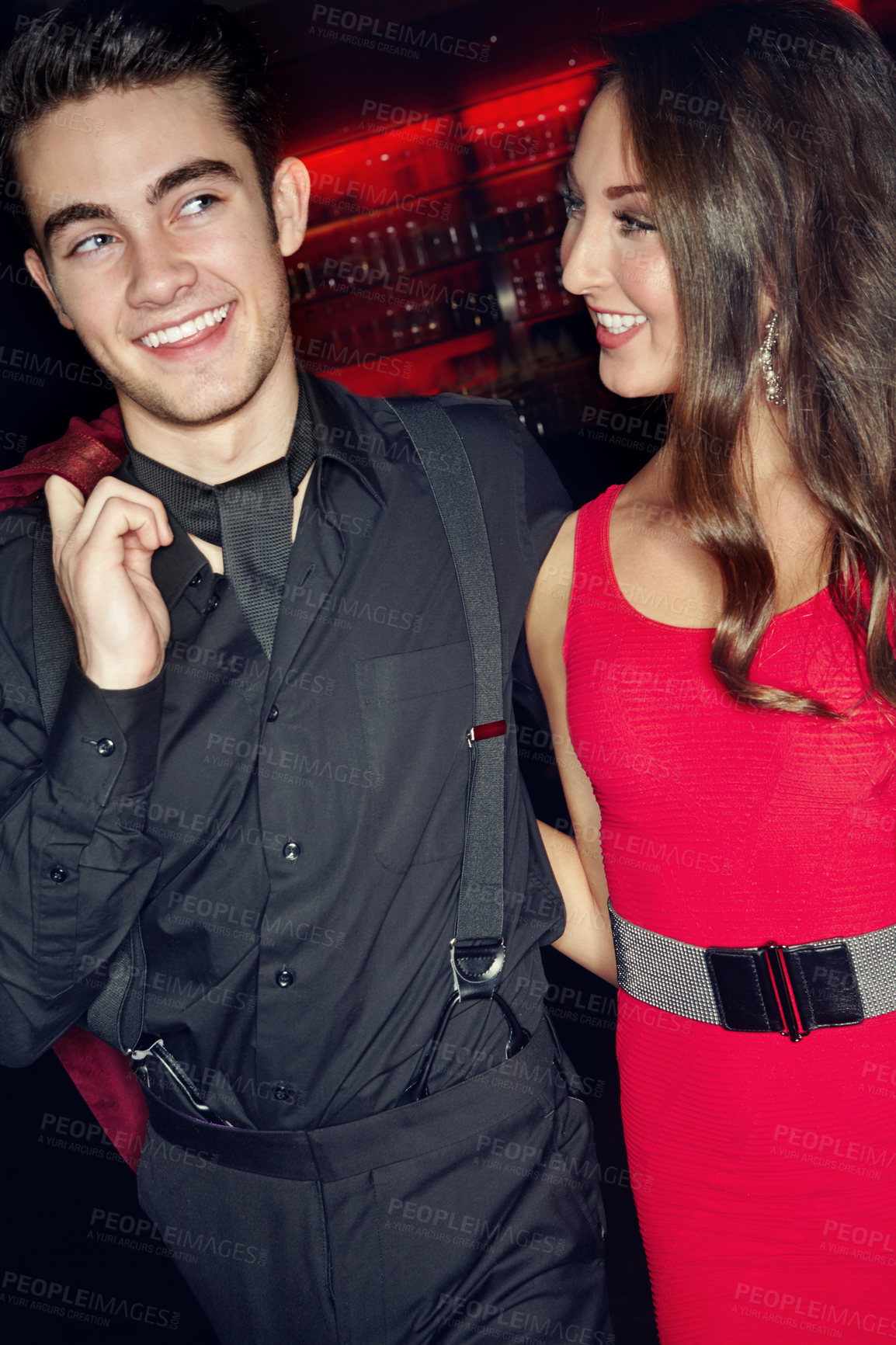 Buy stock photo A young guy and his girlfriend arriving at a nightclub together