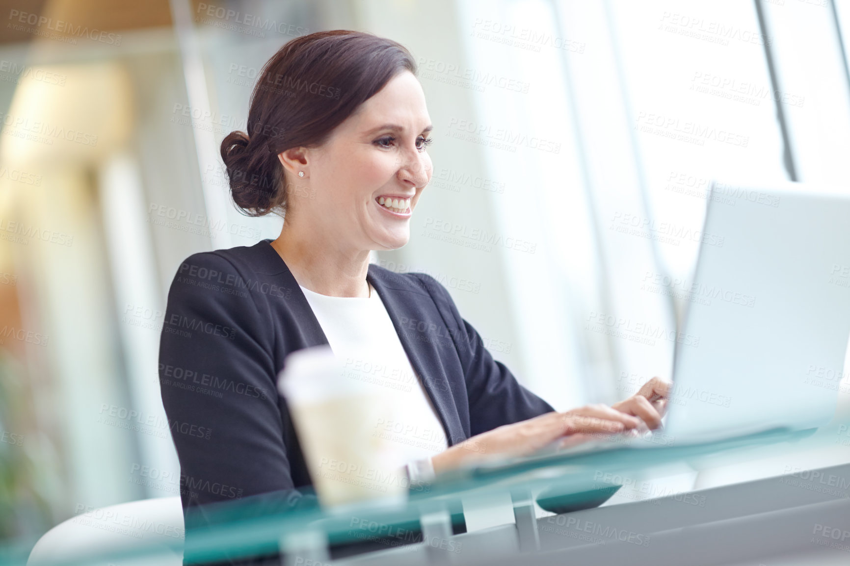 Buy stock photo Laptop, smile and business woman typing work report, project and reading email in corporate office. Computer, happy and insurance agent on internet for policy review, feedback or research information