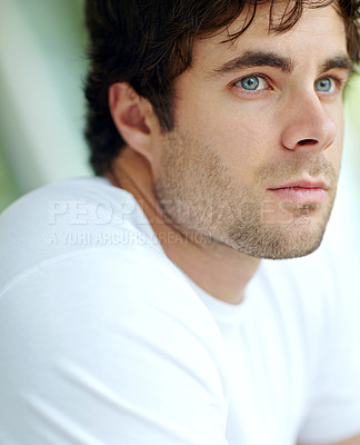 Buy stock photo A head and shoulders cropped shot of a handsome young man