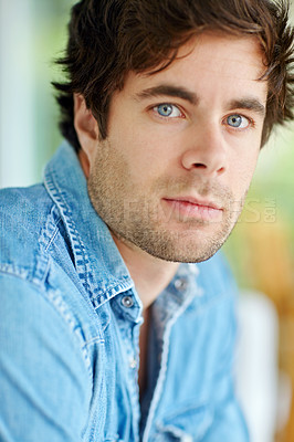 Buy stock photo A head and shoulders cropped shot of a handsome young man