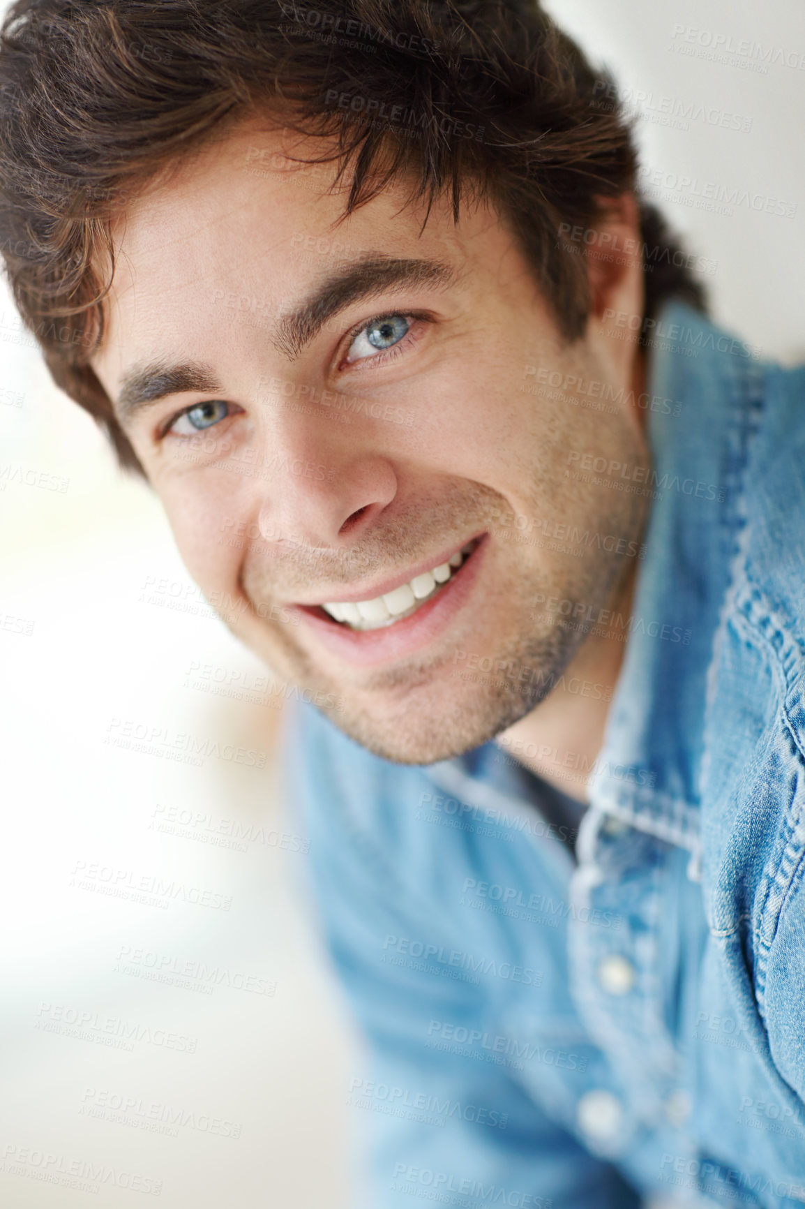 Buy stock photo A head and shoulders cropped shot of a handsome young man