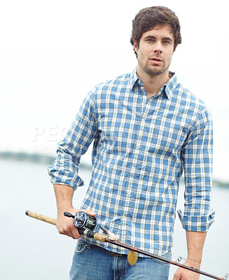 Buy stock photo Portrait, man and fishing rod at lake for holiday, vacation or travel by river in nature. Fisherman, water or male person with pole, equipment and confident or serious angler with hobby in California