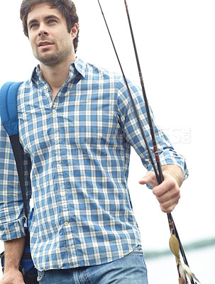 Buy stock photo Fisherman, walking and lake with fishing rod with backpack for sport, hobby or catch by ocean. Male person, fisher or adventure with bag or pole for trap, bait or outdoor sea activity by beach coast