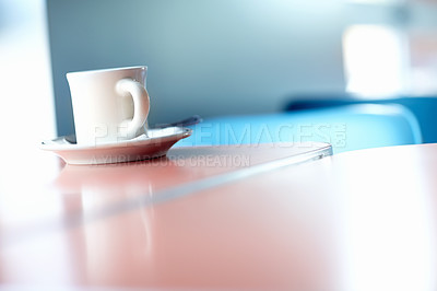 Buy stock photo Closeup of an espresso cup sitting in a saucer