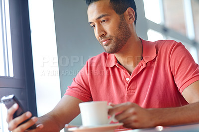 Buy stock photo Man, phone and texting at cafe with coffee cup, relax and check notification with web chat in morning. Person, smartphone and click on mobile app with tea, espresso and social media at restaurant