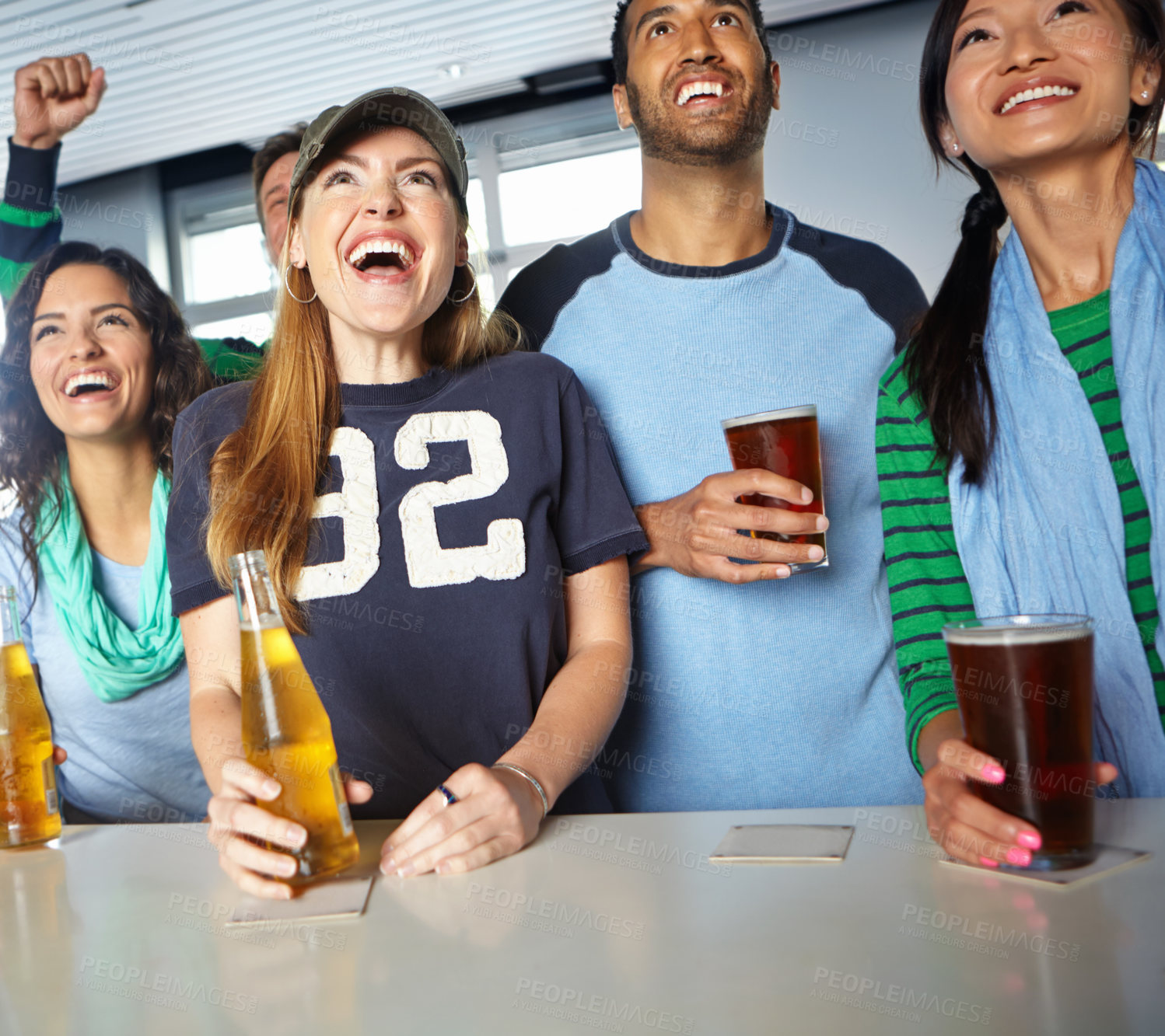 Buy stock photo Pub, soccer and group of fans with beer watching sports match with happiness for winning goal. Supporters, alcohol and people streaming broadcast television of football game for league in bar.