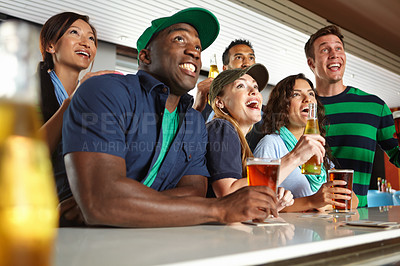 Buy stock photo Pub, sports and group of fans with beer watching soccer match with happiness for winning goal. Supporters, alcohol and friends streaming broadcast television of football game for league in bar.