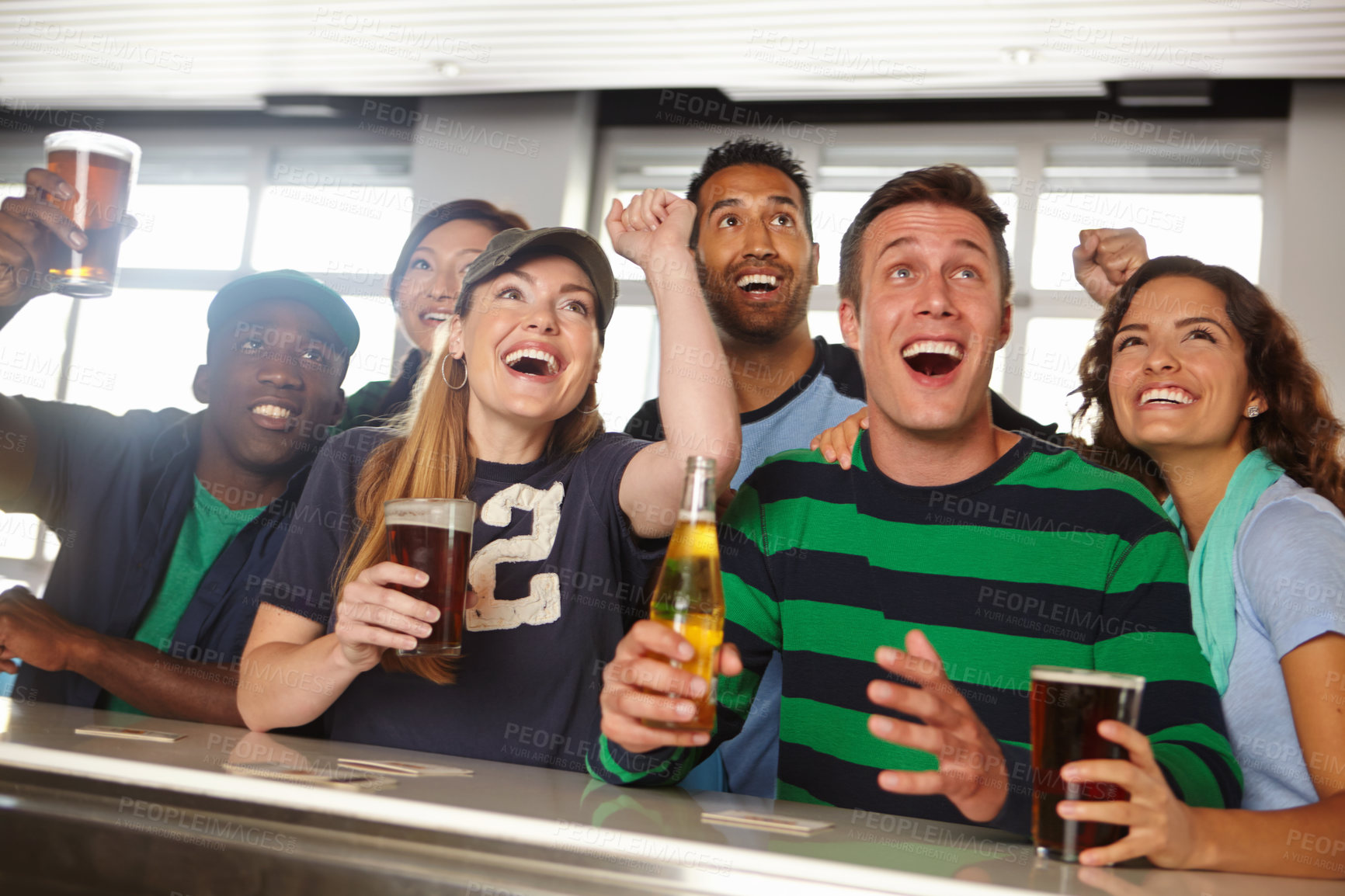 Buy stock photo Pub, friends and football match celebration for sports goal, team passion and live entertainment. Diversity people, happy hour and watching game with cheering, beer beverage or support for tournament