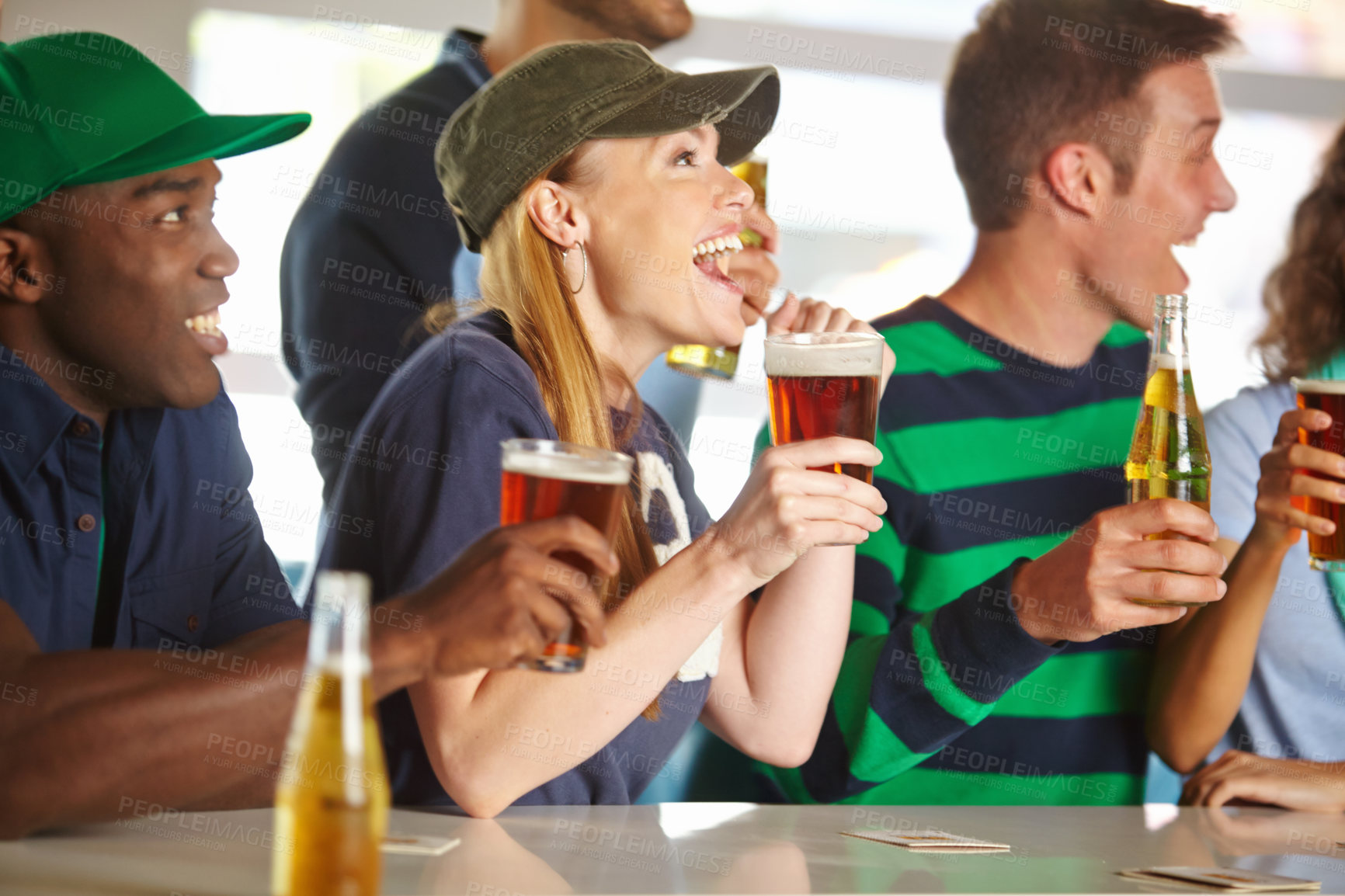 Buy stock photo Profile of a pretty woman cheering her favourite team on with friends