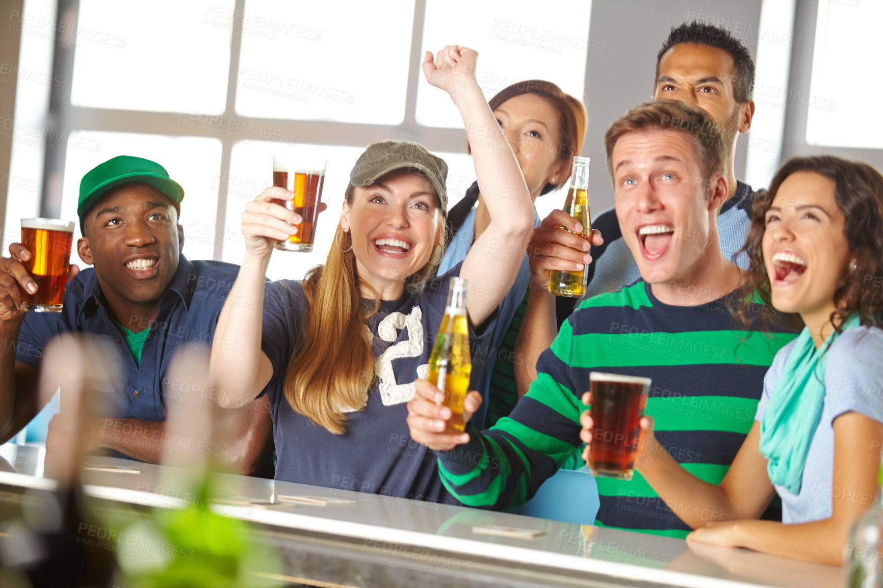 Buy stock photo Sports fans, people and football match celebration in pub for team goal, winning and live entertainment. Diversity group, happy hour and watching game with cheering, beer and support for tournament
