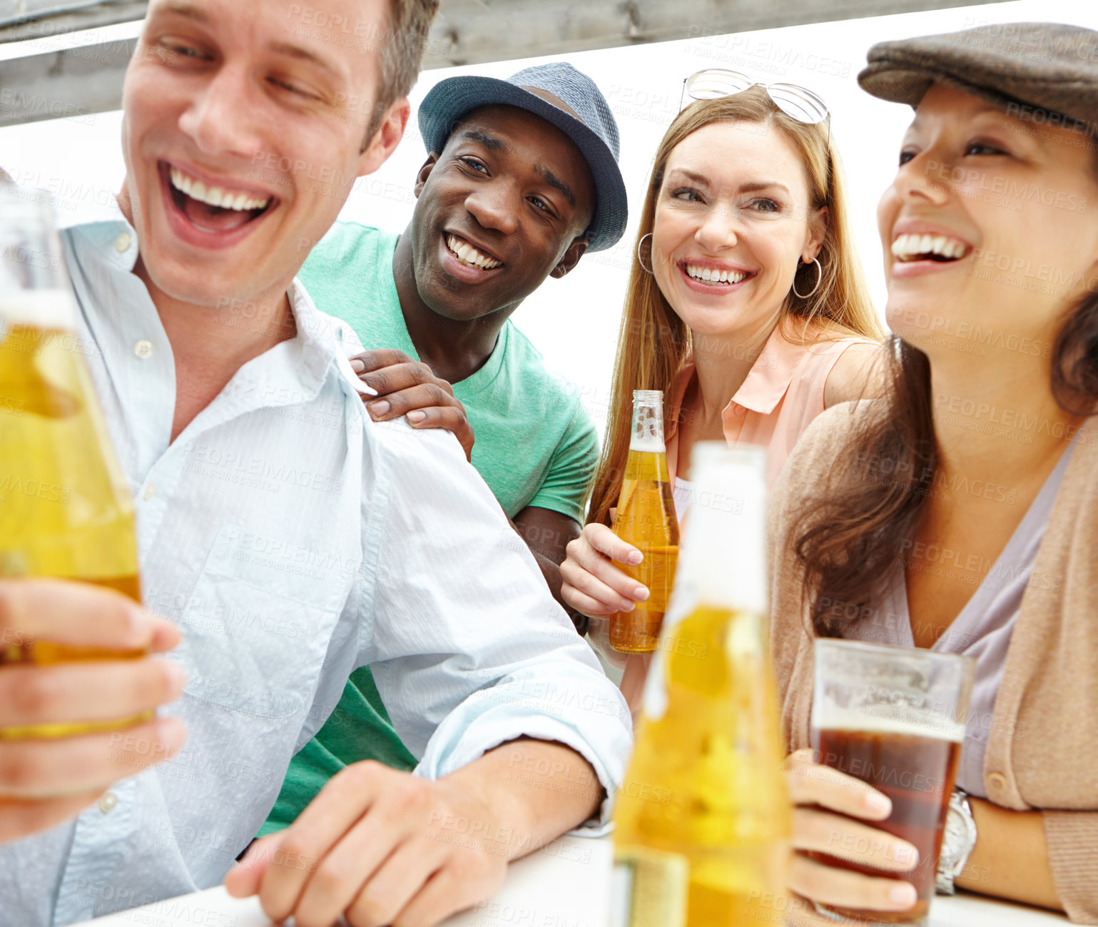 Buy stock photo Beer, drinking and group of friends laughing at pub together for hang our, reunion or social gathering. Alcohol, bonding or diversity with men and women at restaurant for conversation or joking