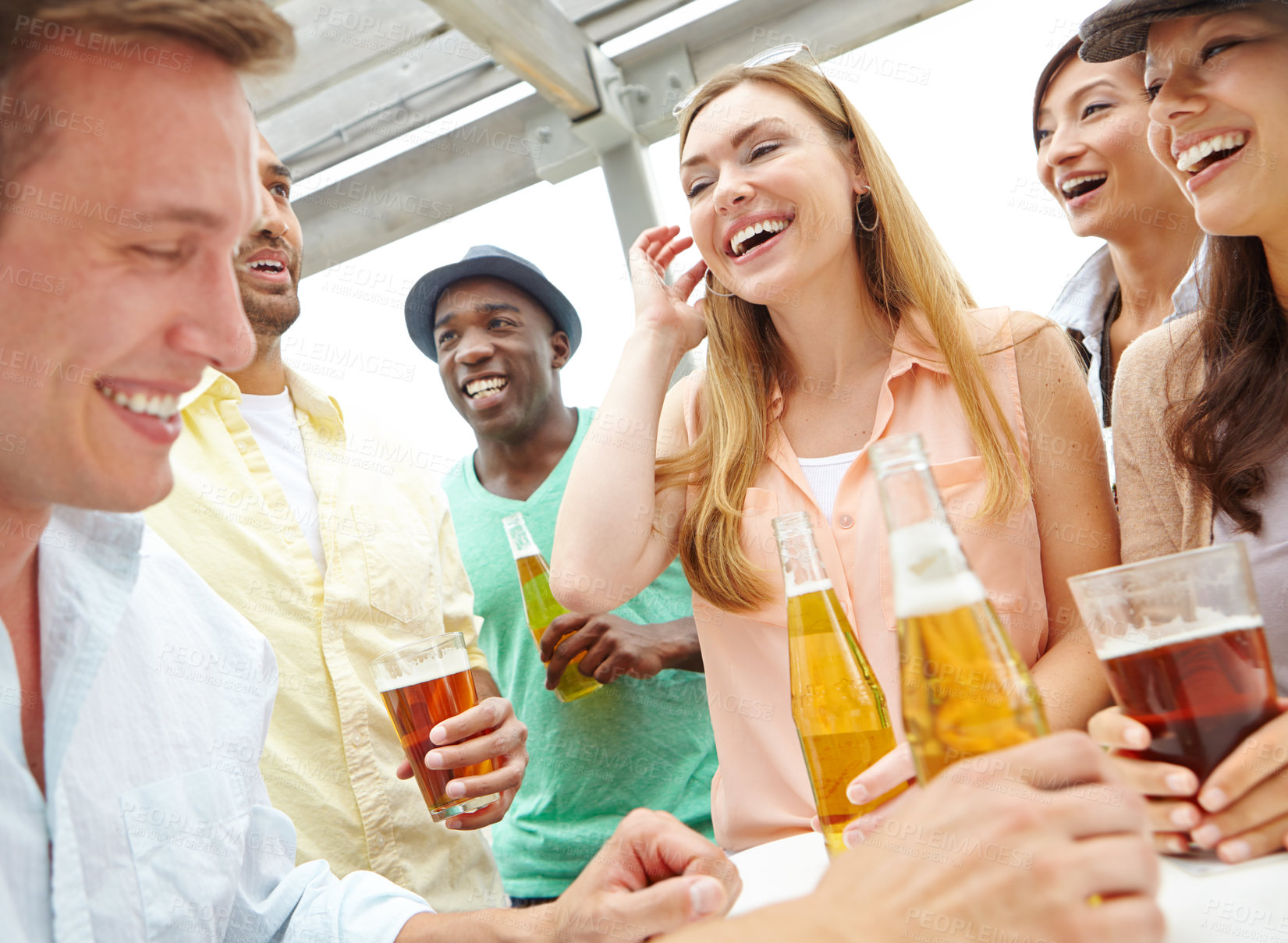 Buy stock photo A group of friends drinking and having a good time at a restaurant