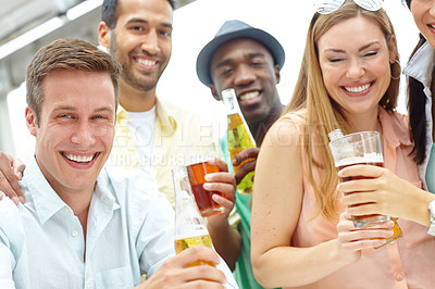 Buy stock photo Portrait of four friends enjoying drinks together at an outdoors restaurant 