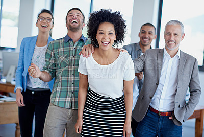 Buy stock photo Shot of a group of happy coworkers celebrating standing in an office