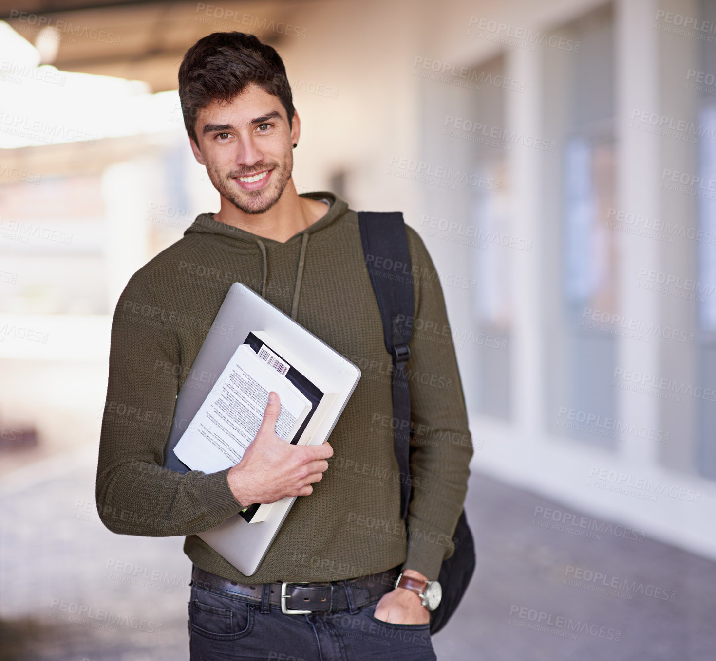 Buy stock photo Cropped portrait of a handsome young man standing outside while on campus