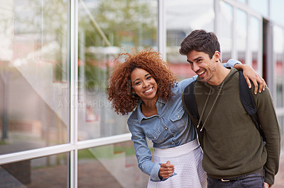 Buy stock photo Happy, interracial couple and student on campus, hug and embrace for love in college. Smile, education and university on walk to class for black woman person, boyfriend and romantic partner learners