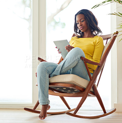 Buy stock photo Portrait, black woman and chair for relax with tablet, home or online for social media or ebook. Technology, article or reading for education for female person, introvert or weekend for calm in house