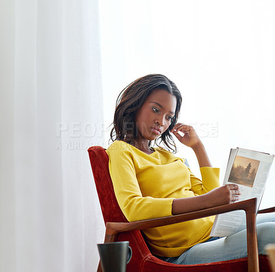 Buy stock photo Cropped shot of an attractive young woman relaxing at home