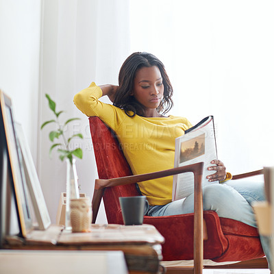 Buy stock photo Relax, reading and black woman with book, home and course in college, studying and preparing for test. Comfortable, chair and dorm of student with literature of art history, peace and learning