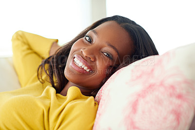 Buy stock photo Black woman, portrait and smile for relax on sofa, weekend break and rest to recharge for week ahead with peace. Girl, casual and comfort in home for lounge with quiet, leisure and stress relief.