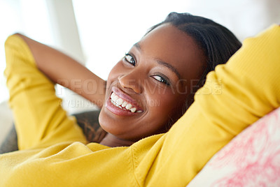 Buy stock photo Black girl, portrait and happy for relax on sofa, weekend break and rest to recharge for week ahead with peace. Woman, casual and comfort in home for lounge with quiet, leisure and stress relief.