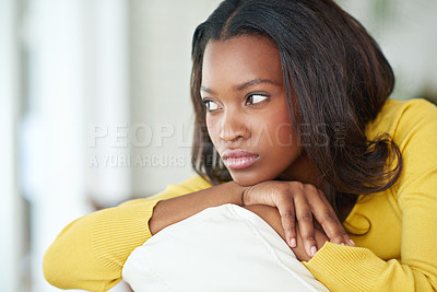 Buy stock photo Cropped shot of an attractive young woman relaxing at home