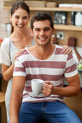 Buy stock photo Couple, relax and portrait in home with coffee in morning for energy, benefits and happiness. Woman, support and care for partner with preparation of drink in kitchen with espresso, latte and love