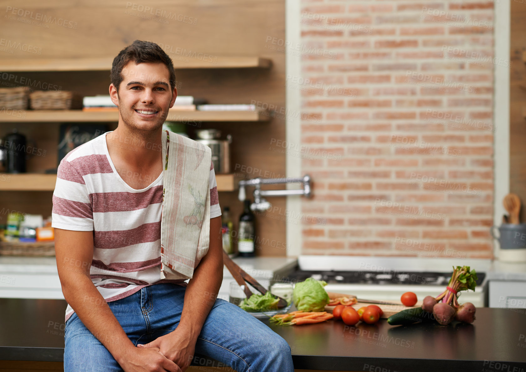 Buy stock photo Cooking, happy and portrait of man in kitchen for food, wellness and nutrition with confidence. Healthy dinner, diet and chef cutting vegetables with towel at home for lunch, vegan or salad in France