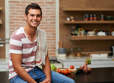 Buy stock photo Cooking, smile and portrait of man in kitchen for food, wellness and nutrition with confidence. Healthy dinner, diet and chef cutting vegetables with towel at home for lunch, vegan or salad in France