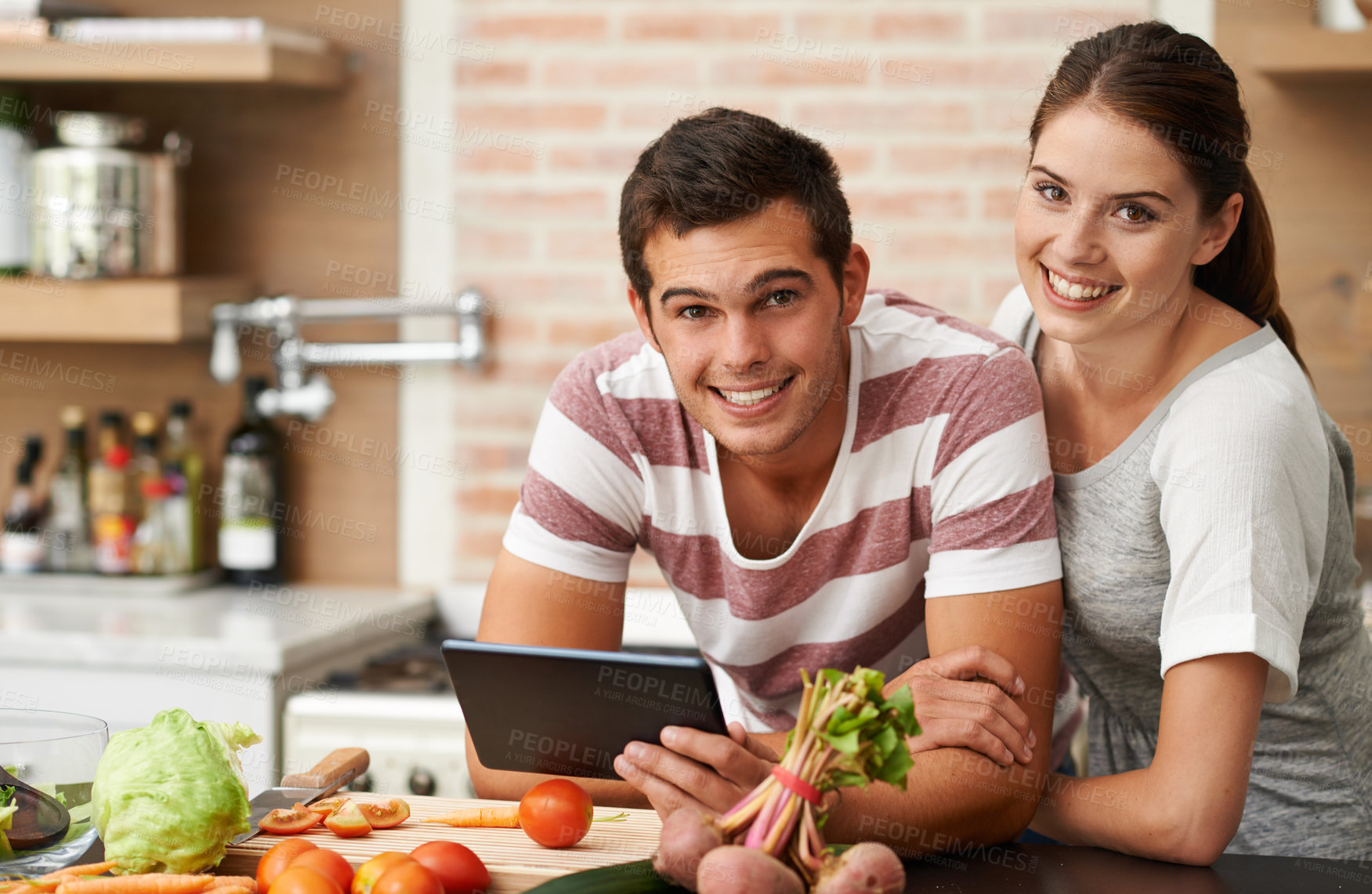 Buy stock photo Cooking, tablet and couple in home portrait for healthy food or vegetables for lunch, steps or dinner recipe. Online, smile and woman in meal prep for salad preparation or hungry vegan man in England