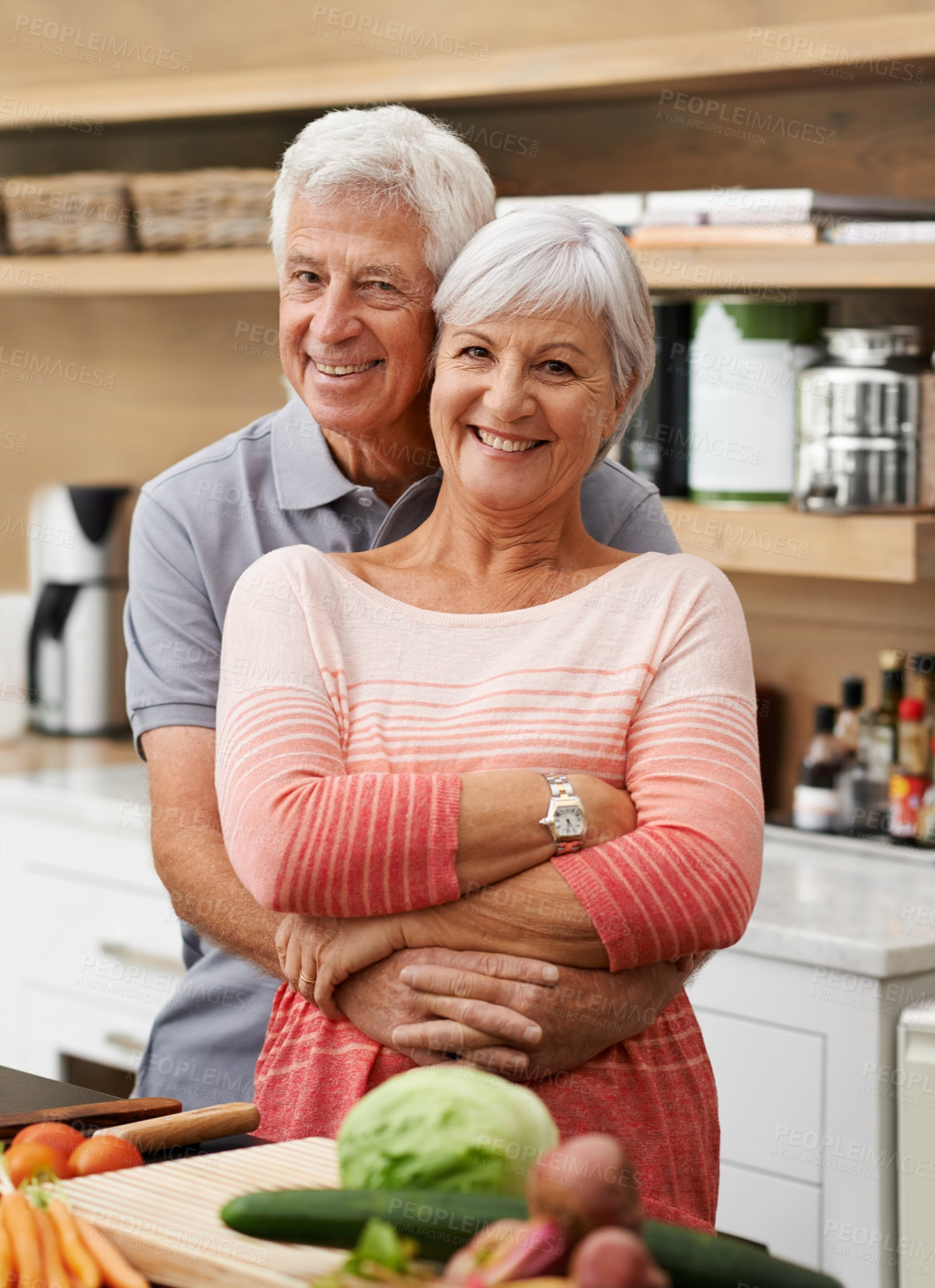 Buy stock photo Cooking, love and portrait of old couple in kitchen for salad, health or nutrition. Happy, smile and retirement with senior man hugging woman and cutting vegetables at home for food, dinner or recipe