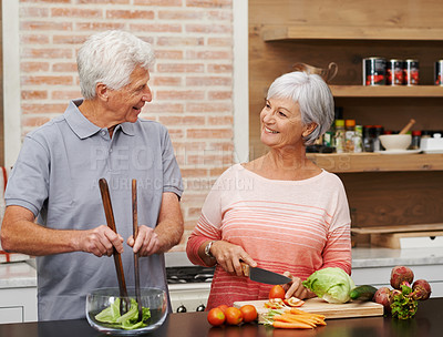 Buy stock photo Cooking, health and help with old couple in kitchen for salad, love and nutrition. Happy, smile and retirement with senior man and woman cutting vegetables at home for food, dinner and recipe