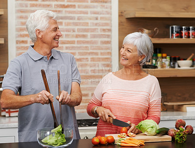 Buy stock photo Cooking, health and happy of old couple in kitchen for salad, love and nutrition. Helping, smile and retirement with senior man and woman cutting vegetables at home for food, dinner and recipe