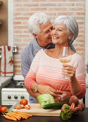 Buy stock photo Senior couple, wine and love in kitchen for happiness, health and retirement in apartment for commitment. Elderly man, woman and cooking together on vacation for lunch, anniversary and gratitude.
