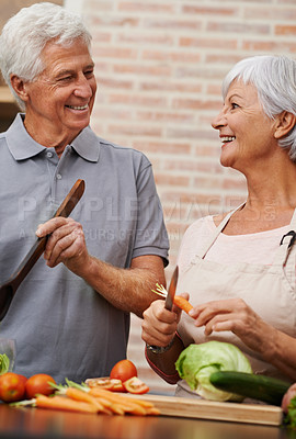 Buy stock photo Cooking, health and lunch with old couple in kitchen for salad, love and nutrition. Happy, smile and retirement with senior man and woman cutting vegetables at home for food, dinner and recipe