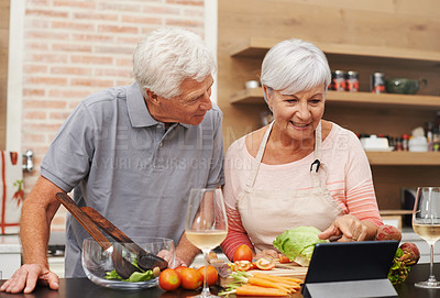 Buy stock photo Senior, couple and online, cooking and tablet for learning, videos and guide for diet and internet. House, old man and woman in kitchen, together and healthy food, champagne and meal prep with app