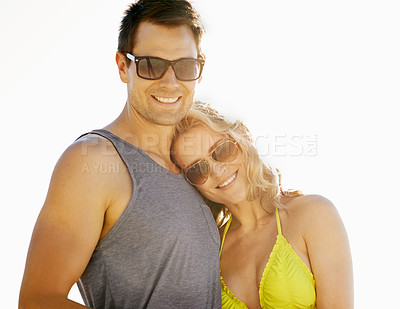 Buy stock photo Happy, couple and smile on vacation by beach with sunglasses, hug and holiday for memories or honeymoon. Woman, man and relationship at destination by ocean for trip, getaway or weekend for bonding