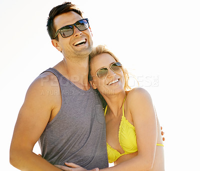 Buy stock photo Happy, couple and smile on vacation by beach with sunglasses, hug and holiday for memories or honeymoon. Woman, man and relationship at destination by ocean for trip, getaway or weekend for bonding