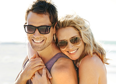 Buy stock photo Closeup shot of a couple posing intimately on the beach