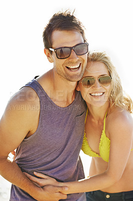 Buy stock photo Happy, couple and laugh on vacation by beach with sunglasses, hug and holiday for memories or honeymoon. Woman, man and relationship at destination by ocean for trip, getaway or weekend for bonding