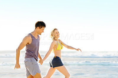 Buy stock photo Couple, happiness and running on beach for fitness, health and exercise in nature for workout. Man, woman and holding hands in summer for love, training and holiday at beach for support and travel.