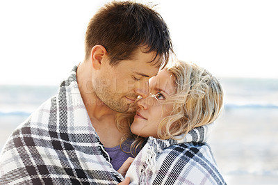 Buy stock photo Couple, hug and love by ocean for travel, vacation and relax in summer by nature with care. Man, woman and embrace on beach in Florida for adventure, holiday and freedom with romance, happy and smile