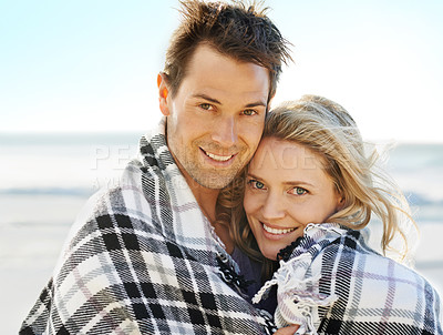 Buy stock photo Couple, happy and blanket on beach with portrait for picnic, vacation and relax in summer by nature in love. Man, woman and embrace by ocean in Florida for adventure, holiday and freedom with smile