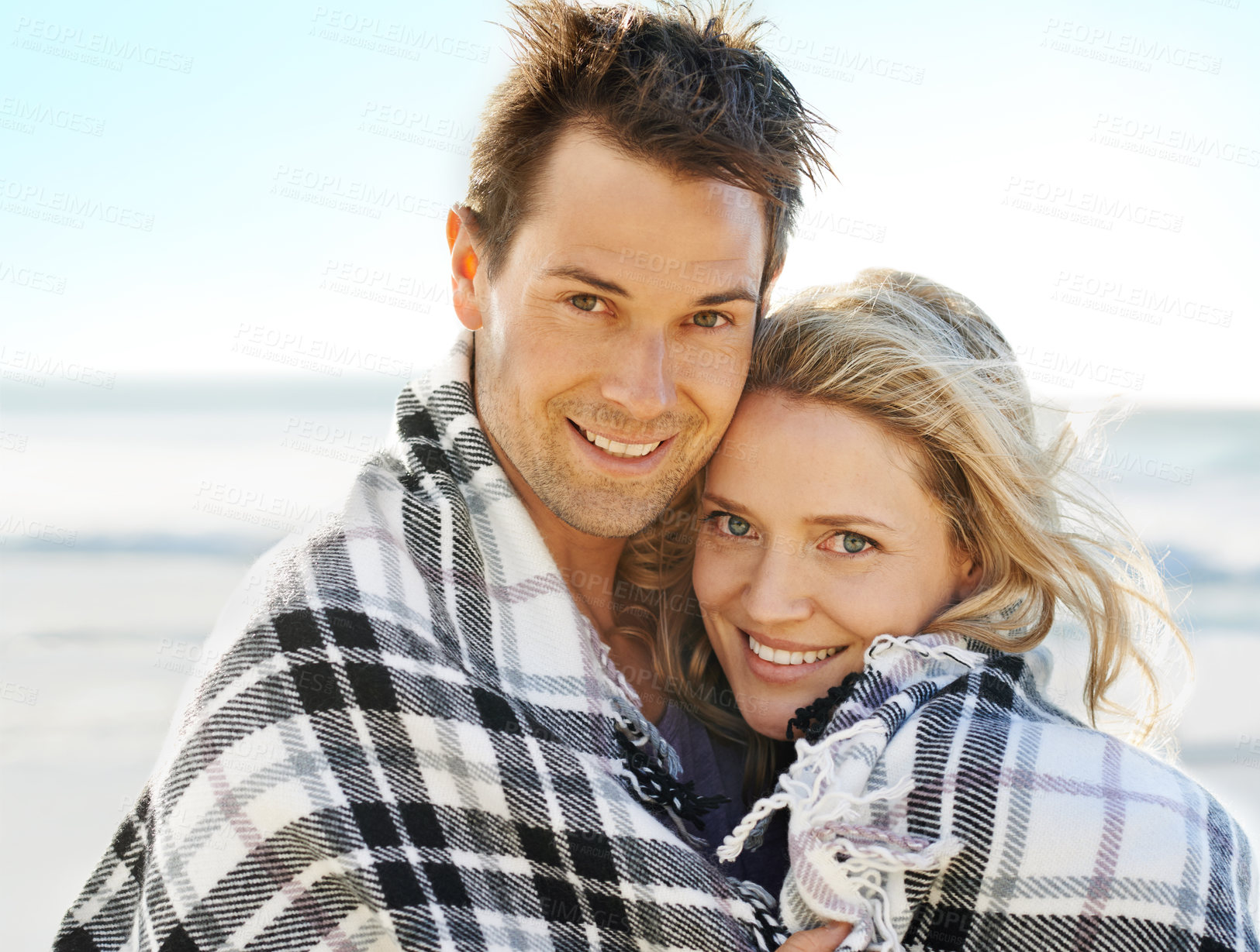 Buy stock photo Couple, happy and blanket on beach with portrait for picnic, vacation and relax in summer by nature in love. Man, woman and embrace by ocean in Florida for adventure, holiday and freedom with smile