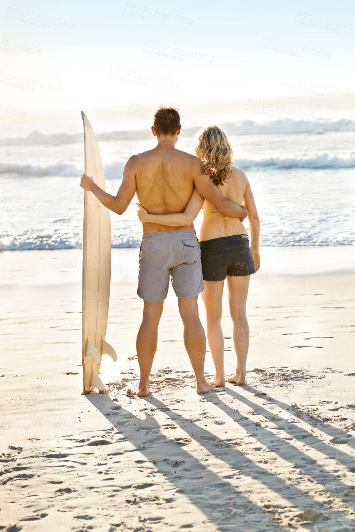 Buy stock photo Couple, surfer and search for waves in summer at beach for vacation, exercise and fitness in ocean. Man, woman and sport for training, challenge and adventure on holiday by the sea, sand and nature.