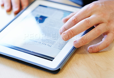 Buy stock photo Cropped closeup shot of a businessman working on a digital tablet