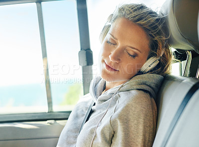 Buy stock photo Headphones, relax and woman in car for road trip in summer listening to music, radio or podcast. Calm, sleeping and female person streaming album or song in van driving to vacation or holiday.