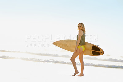 Buy stock photo A young surfer girl on the beach during the summer time