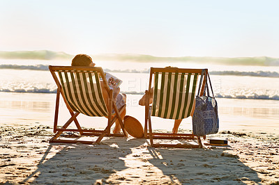 Buy stock photo Back, chair or couple at sea to relax for holiday, vacation or anniversary romance in summer. Travel, magazine or woman on date with man reading newspaper at beach or ocean for horizon view in Hawaii