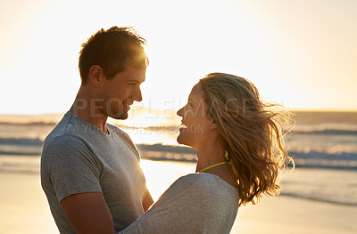 Buy stock photo Love, sunset or happy couple hug at beach on holiday, vacation or anniversary romance in summer. Travel, smile and people on date at sea, nature or ocean for bonding, support and honeymoon in Hawaii